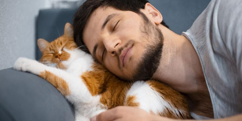 man and cat cuddling